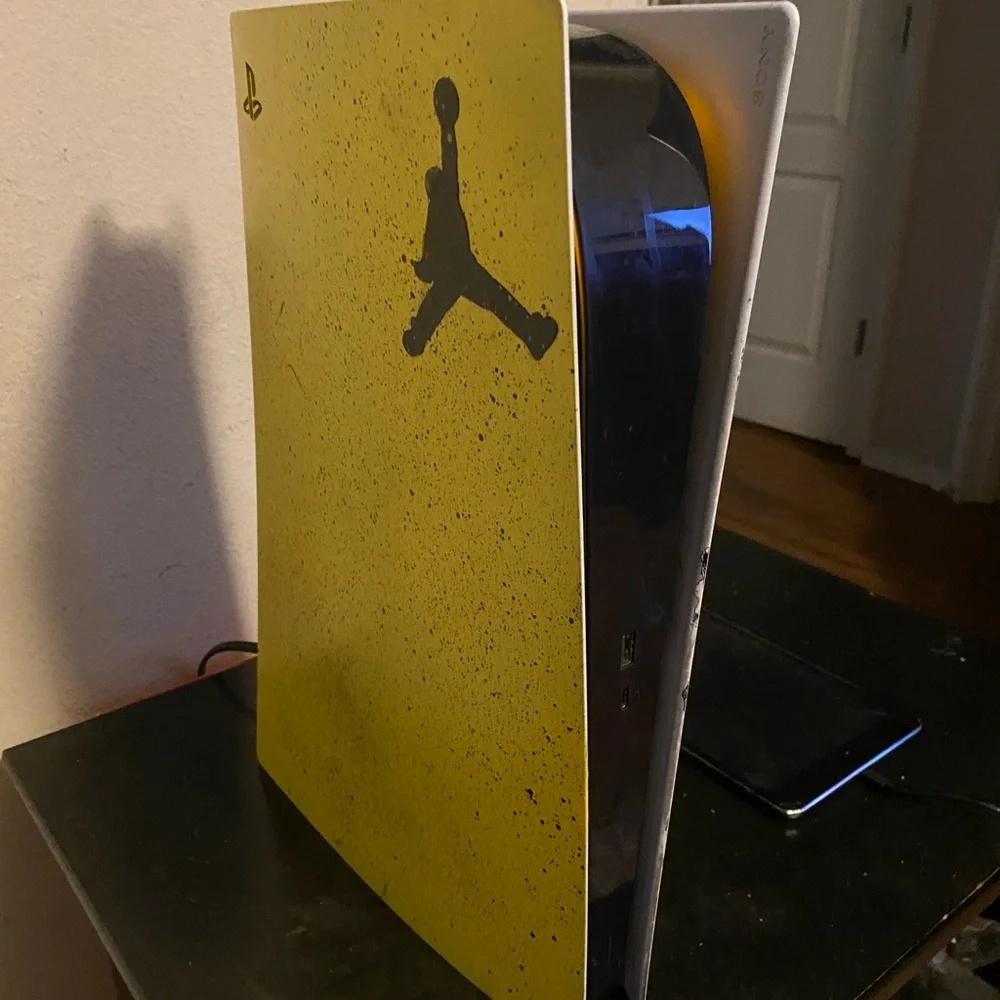Yellow PlayStation Console with Jordan Logo